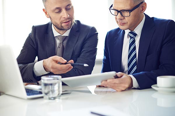 Business Men on Laptop and Tablet